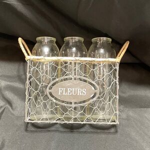 Wire Basket with Glass Bottles for flowers.